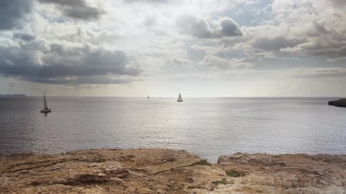 Timelapse of the sea and clouds. Great reflection on tne water. Clouds moving, weather changing. Sai