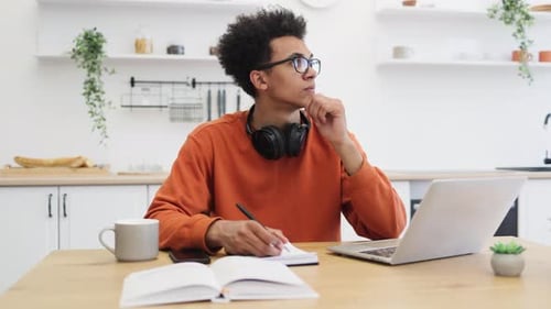 Young Man Studying at Home