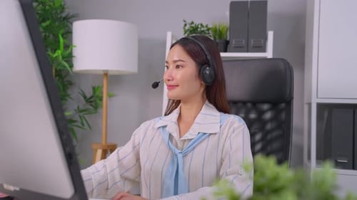 Asian beautiful businesswoman call center working in office corporate.
