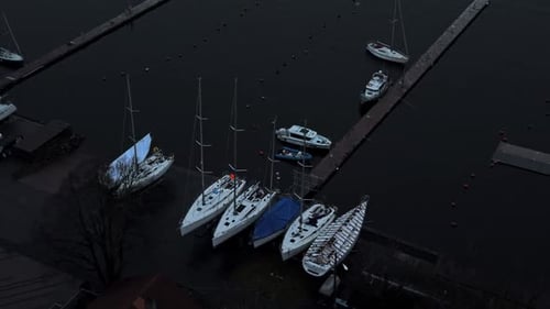 Refined Vessels Anchored By Gleaming Shores Sophisticated Ships Tied Up Near Shimmering Waterfront
