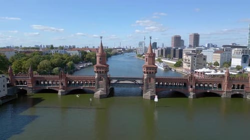 Summer day east west Berlin Border River Bridge Germany. Smooth aerial top view flight ascending
4k