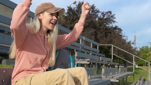 Teen Cheer for Favorite Team on Stadium