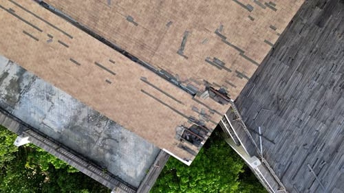 Aerial view look down broken rooftop building