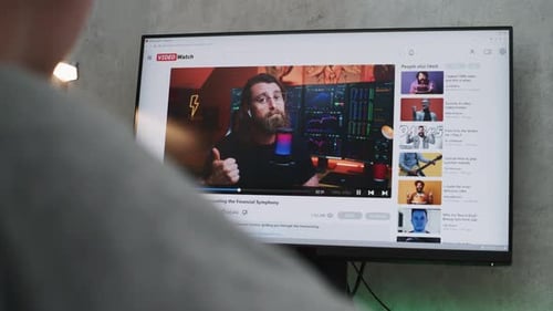 PC Monitor Shows Video Sharing Platform with Blogger Content About Stock Trading