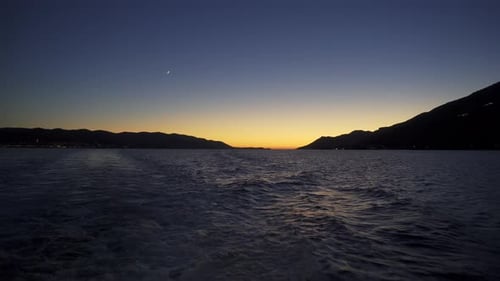 Water Rippling at Sunset in a Mountainous Area