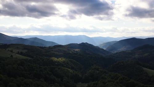 Aerial View of Carpathians Landscape Sun Rays Break Through the Clouds Over Mountains