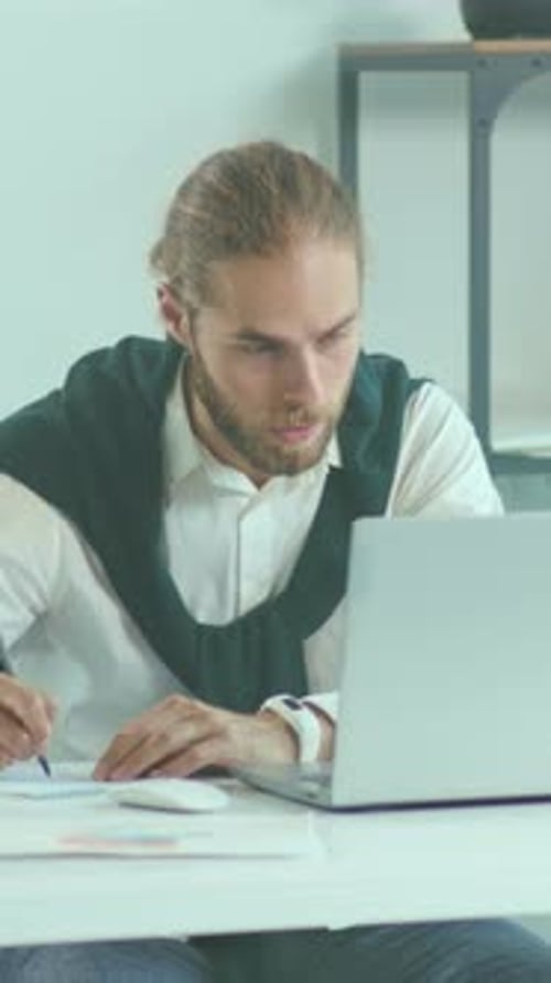 Man Sketches Work Man Meticulously Develops Project Layouts Using Pen and Paper During Creative