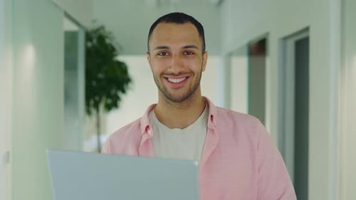 Handsome Multiethnic Businessman Office Worker Standing Near Workplace Holding Laptop
