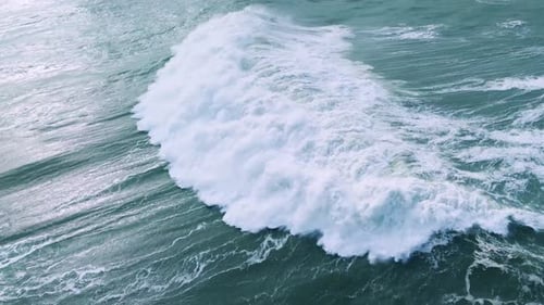Aerial View of a Powerful Ocean Wave Crashing