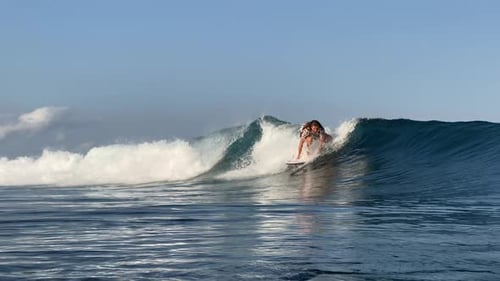 Young Man Surfing in the Ocean