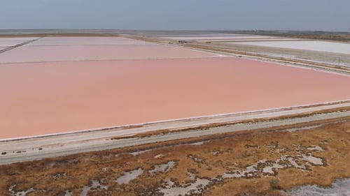 Aerial View Above Red Salt Production Pools in Albania Drone Shot
