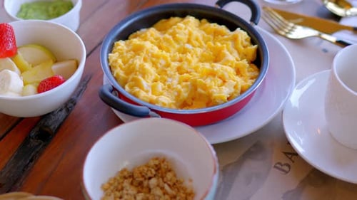 Delicious Breakfast: Scrambled Eggs, Fruit, and Granola
