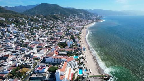 panoramic mountain coastline of Puerto Vallarta Mexico on sunny day, aerial