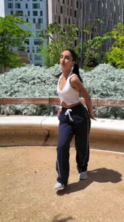 Woman Dancing in Urban Cityscape