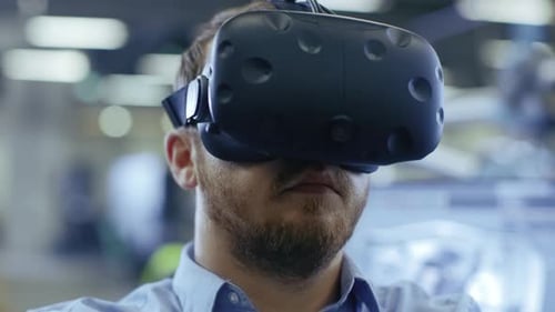 Man Using Virtual Reality Headset in Workplace