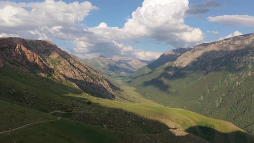 Breathtaking Valley Landscape Unveiling Majestic Mountains and Lush Greenery