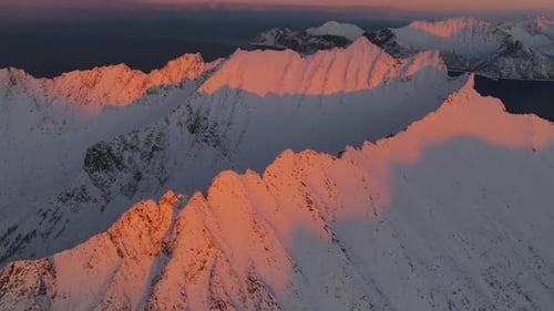 Aerial view of snowy mountain peaks, Norway.