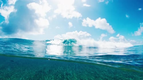 Pure Blue Ocean Wave Breaks on the Shore in Tropics