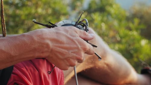 Man Hiker Setting Up a Portable Gas Camping Stove in the Beautiful Outdoors of Natures Wilderness