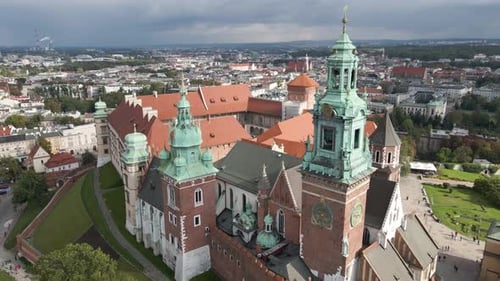 Wide retreating shot of historic buildings in Krakow Poland on an overcast day