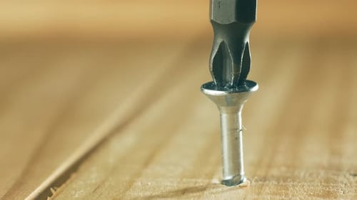 Closeup Silver Self Tapping Screw Unscrewing From Wood Board Macro View Hardware Fastener Reversing