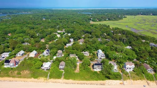 Cape Cod Aerial of Beach Houses Beside Low Tide Shoreline