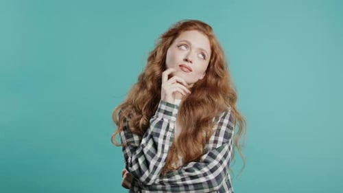 Pensive Around Stylish Woman on Blue Background Puzzled Lady Looking for Answer