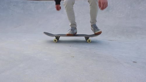 Close-Up of a Skater Executing an Ollie at the Skate park, 4k slow motion