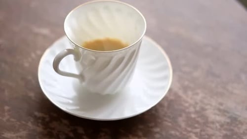 Close Up of Empty Coffee Cup on Table