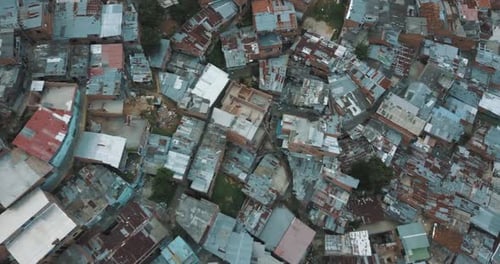 Drone aerial bird's-eye view of ghetto slums in a poor area of Comuna 13, Medellin, Colombia
