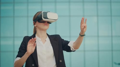 Woman Engineer Wearing Virtual Reality Headset Works and Gestures in VR