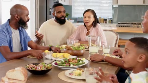 Family Mealtime Conversation in Bright Home Kitchen