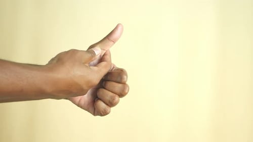 Man Suffering Thumb Finger Pain