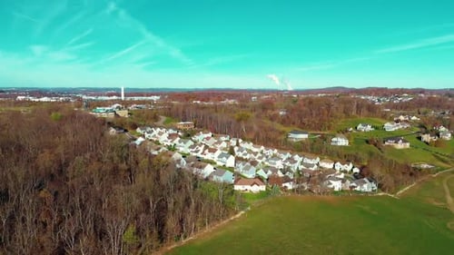 Drone Overview of Residential Suburb Surrounded by Fall Trees