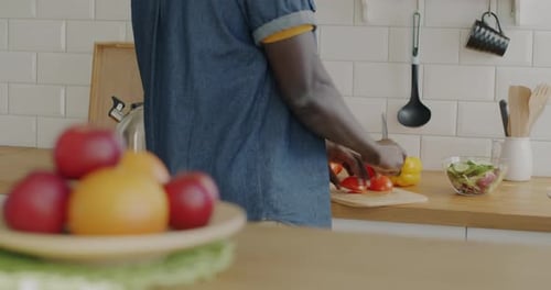 Preparing Vegetables in a Bright Kitchen