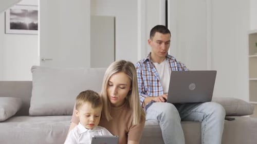 Family Uses Technology Together in Modern Home
