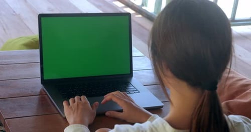 Rear View Woman at Coffee Shop Working on Laptop Computer with Green Screen Chroma Key at Cafe Over