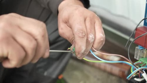 Electrician Works on Electrical Wiring Close Up