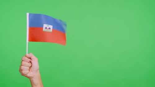 Hand Waving Haitian Flag on Green Screen