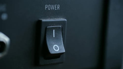 Finger Turning Power Switch On, Close Up