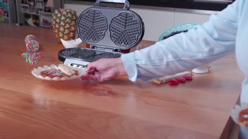 Belgian waffles with fruits, toppings and whip cream ready to eat, tilting view