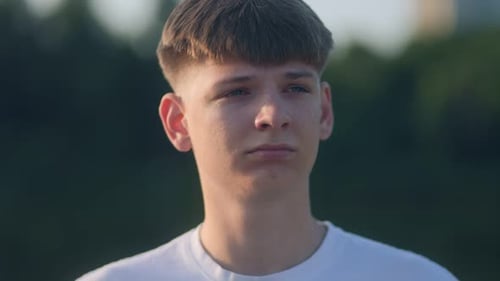 Teen Boy Portrait in Urban Park Sunlight