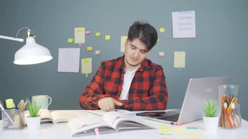 Stressed And Nervous Male Student.