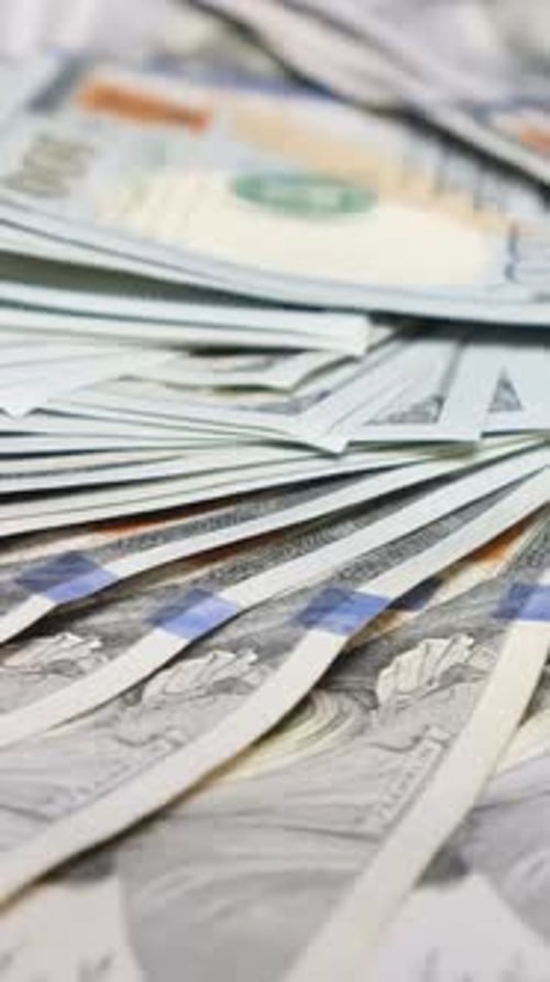 Close Up of One Hundred Dollar Bills Rotating in a Circle Us Dollars Paper Money Cash Background