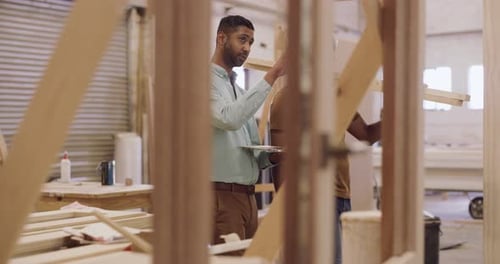 4k video footage of two young men working in a workshop