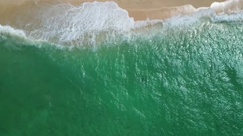 Sea Waves Breaking on Sand Beach