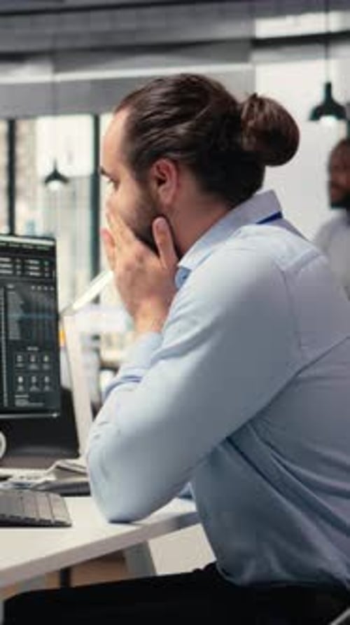 Vertical Video Trader Covering Face in Disbelief Concerned By Investment Portfolio Value Drop