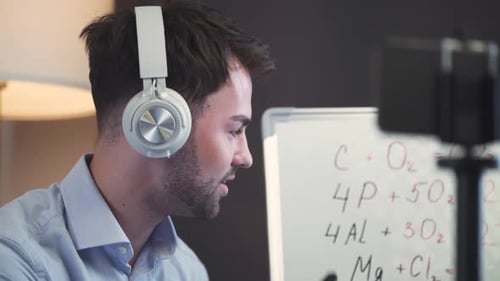 Young Man Explaining Chemistry in a Video Call