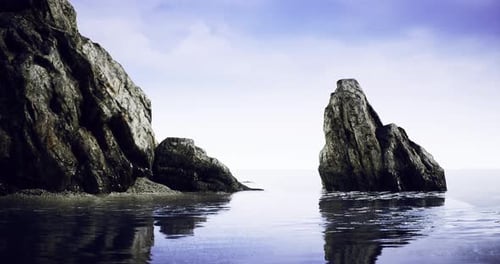 Majestic Coastal Rocks Reflect Under Twilight Sky at a Serene Beach