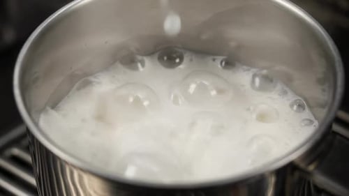 Steaming Milk Pour into Saucepan
